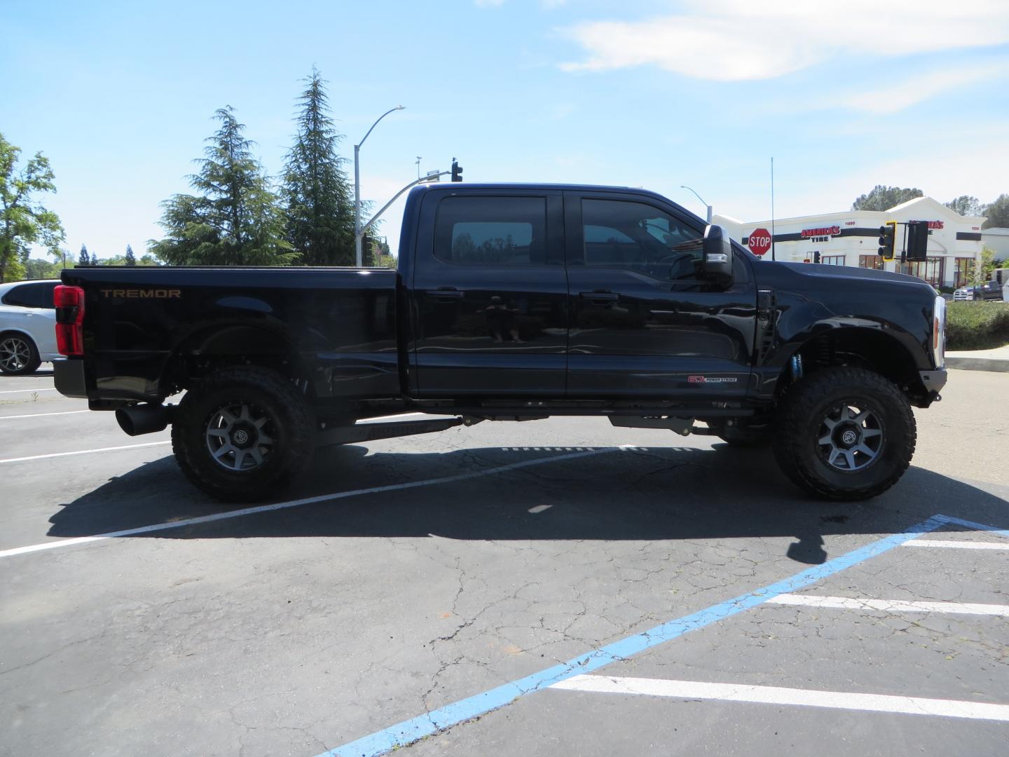 2023 BLUE /BLACK Ford F-350 SD Lariat Crew Cab Long Bed 4WD (1FT8W3BM9PE) with an 6.7L V8 OHV 16V DIESEL engine, 6A transmission, located at 2630 Grass Valley Highway, Auburn, CA, 95603, (530) 508-5100, 38.937893, -121.095482 - Sinister Diesel Built 23 Lariat Superduty with a ton of extras....... Sinister custom radius arms and traction bars, King Offroad shocks & Steering stabilizers, 18" Icon Rebound wheels, 37" Nitto Recon Grappler tires, Cat Back Exhaust, PMF rear leaf Springs, Sinister Front and Rear bumpers, Rigid Li - Photo#3